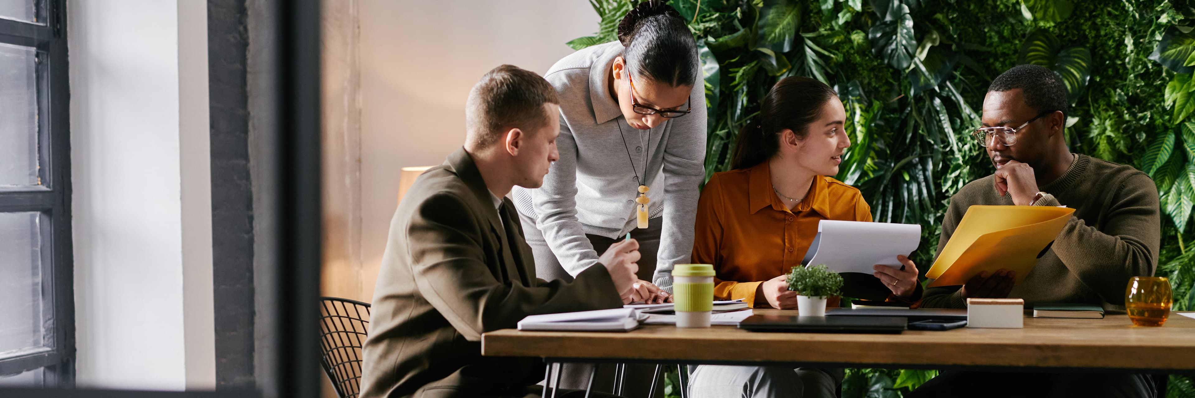 A team reviewing documents together at a shared table